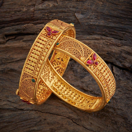 The symbolism of bangles: Discuss the symbolism of bangles in different cultures and religions, and how they are used in ceremonies and rituals.